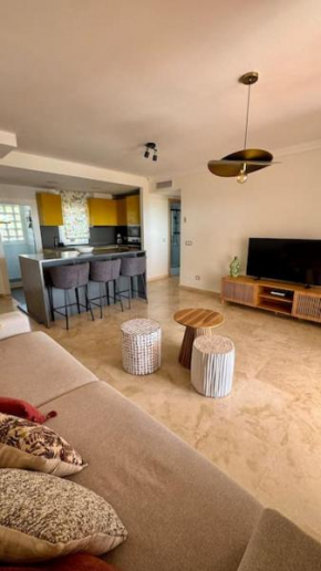 Logement vue mer, golf et jardin